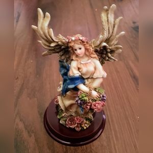 Angel Figurine with Basket of Flowers and Blue Ribbon